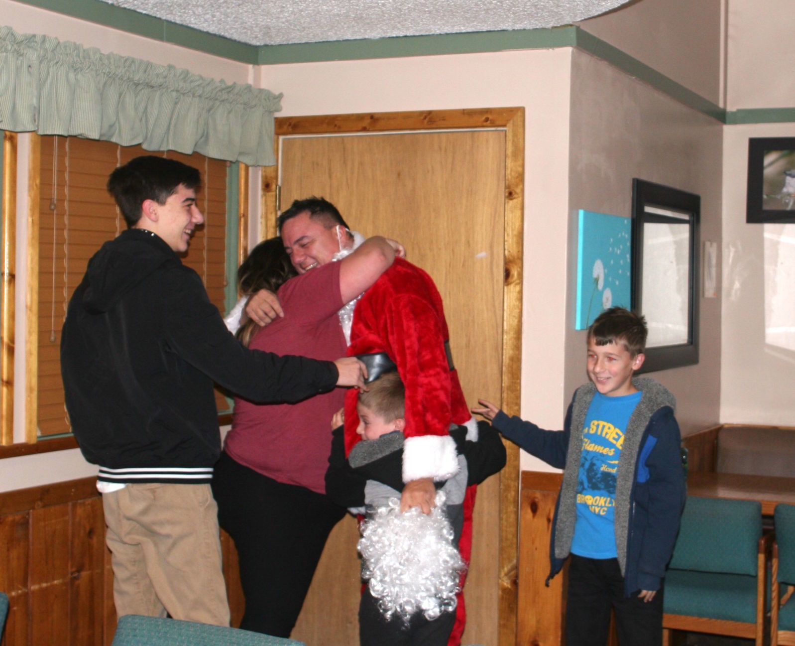 Great grandmother brings Dad home for Christmas - hugs for dad